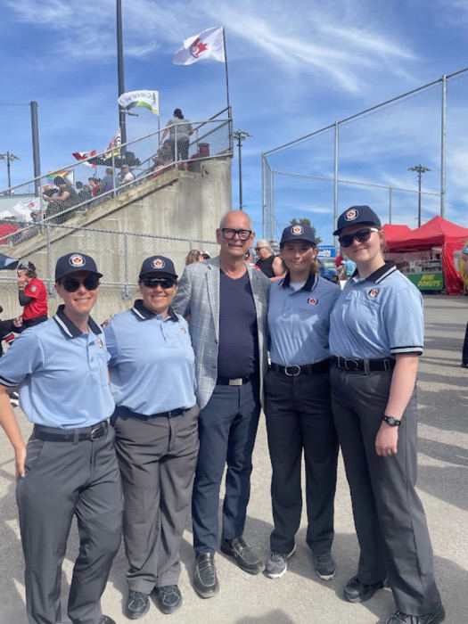Ernie with umpires at a local baseball tournament