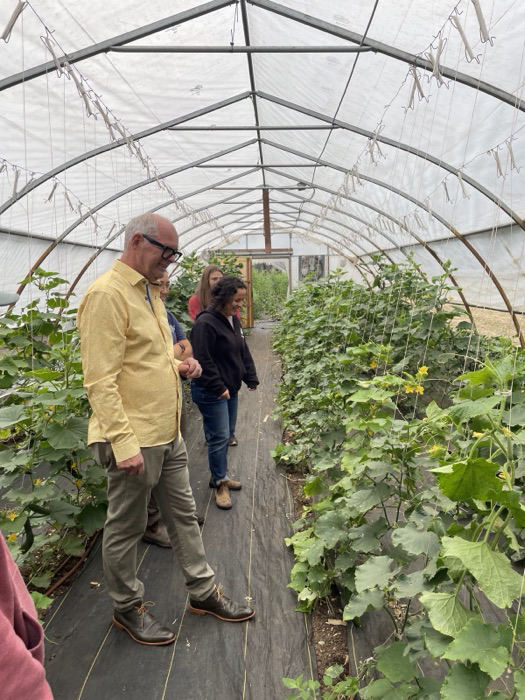 Ernie touring a greenhouse