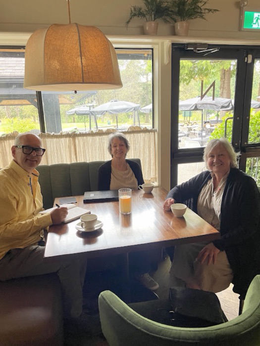 Ernie meeting residents at a local café