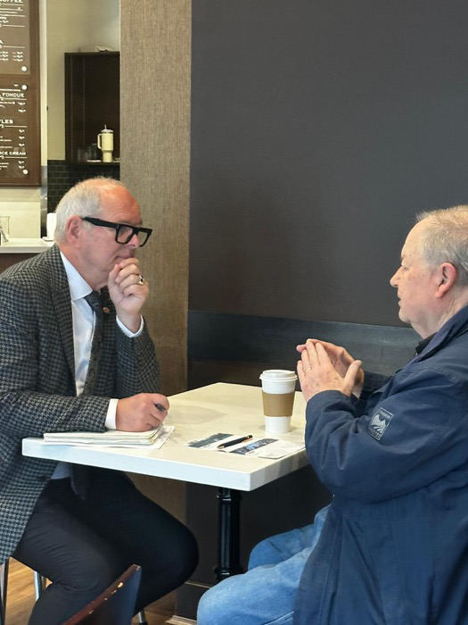 Ernie in conversation with a constituent over coffee